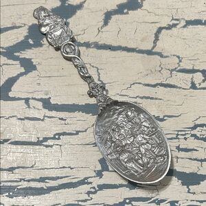 Decorative Pewter Spoon with Intricate Design